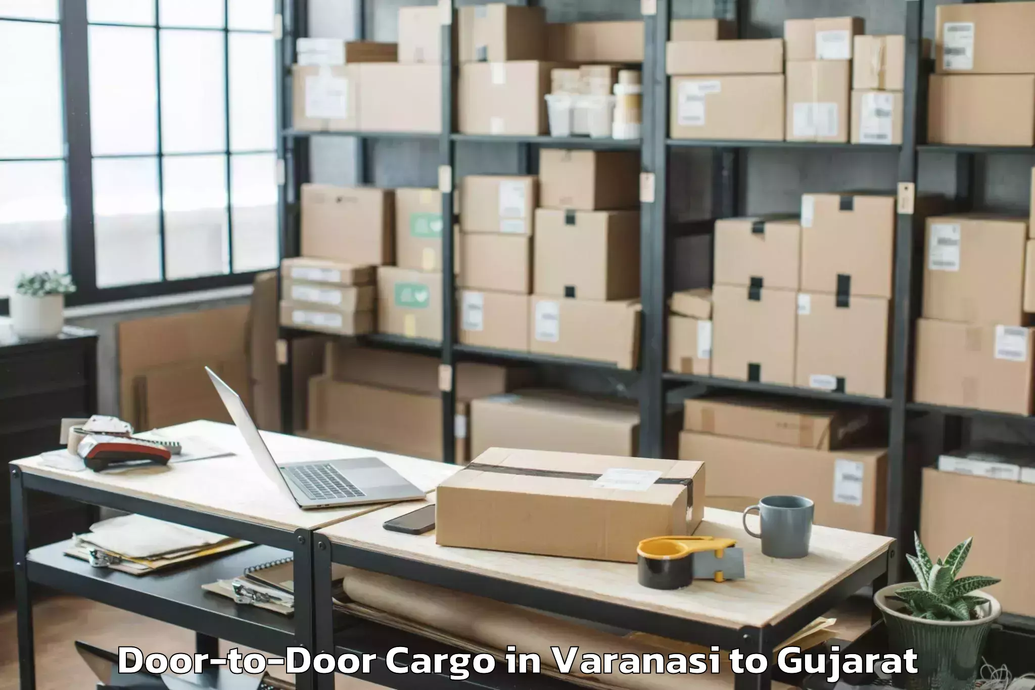 Expert Varanasi to Lodhika Door To Door Cargo